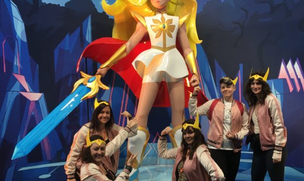 Josie with fellow writers in front of She-Ra at New York Comic-Con in 2018.