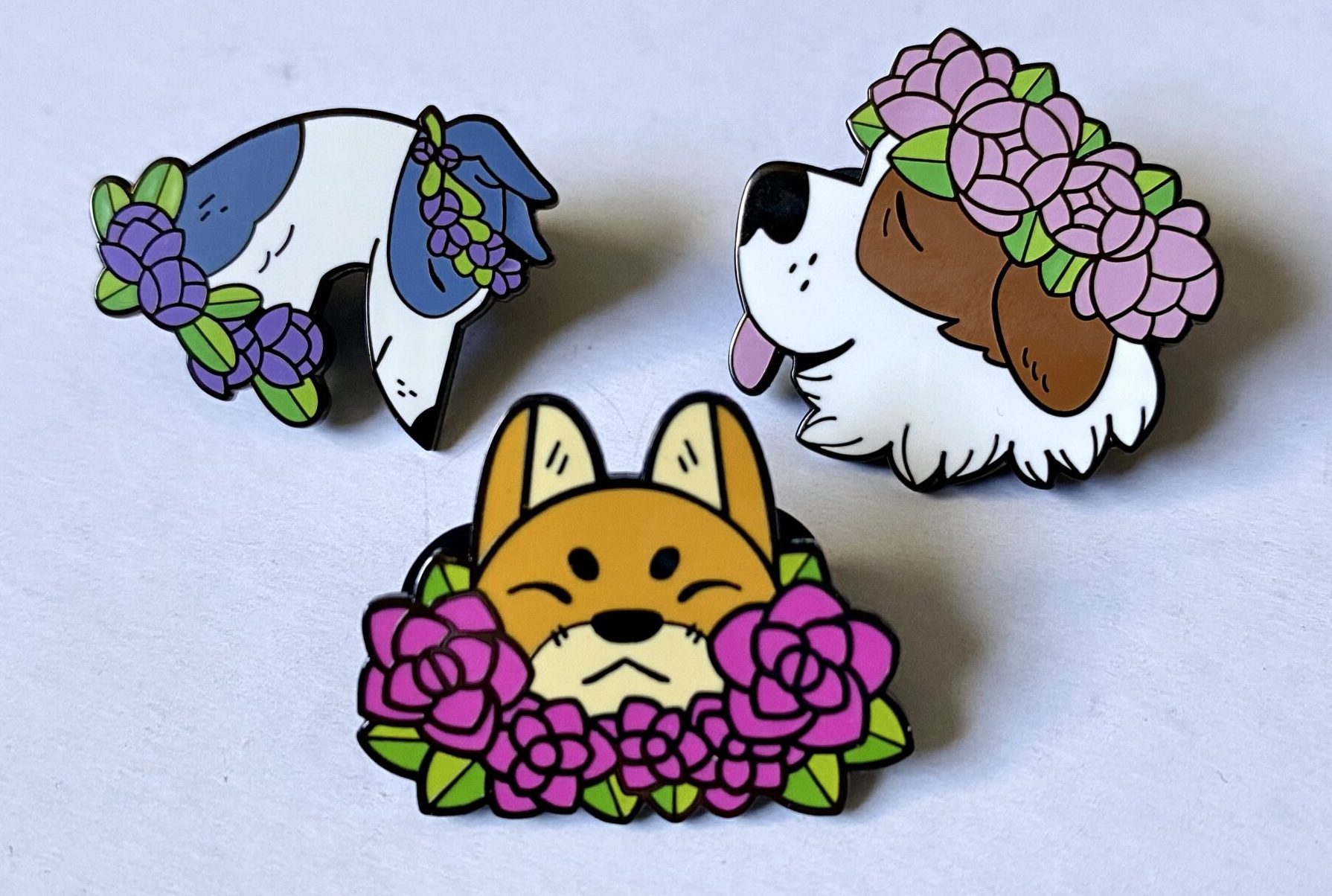 Pins of dogs wearing flowers