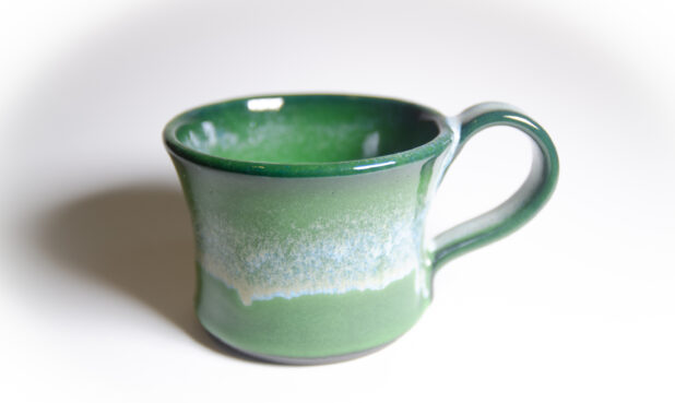 TITLE: CERAMIC CUPS AND MUGS SIZE: 3"-5" wide, 3"-6" inches deep DESCRIPTION: Each Wheel-thrown before being trimmed and having a handle attached. Some mugs are hand-painted and others are dipped. Each is handmade and unique. PRICE: $30-$50