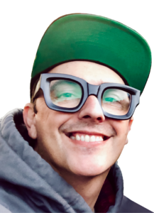 Photo of man's face with big glasses and green baseball cap.